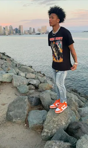 Mikey’s Outfit in Travis Scott Merch T-Shirt, Burberry Sweatshirt & MCM (2021)