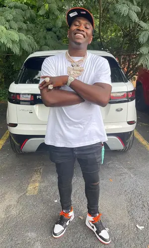 Bankroll Freddie wearing New Era cap