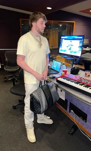 Murda Beatz wearing Givenchy jeans