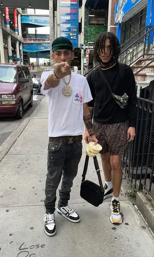 J.I. wearing Louis Vuitton belt