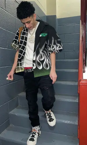 J.I. wearing Prada shirt