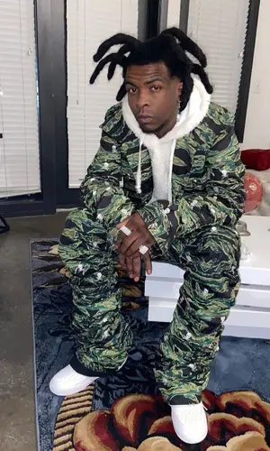Yak Gotti wearing Human Nature pants