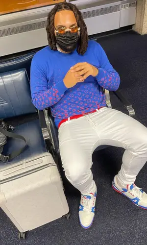 Money Man wearing Louis Vuitton bag