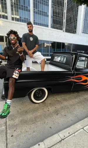 Saint JHN wearing Bottega Veneta eyewear