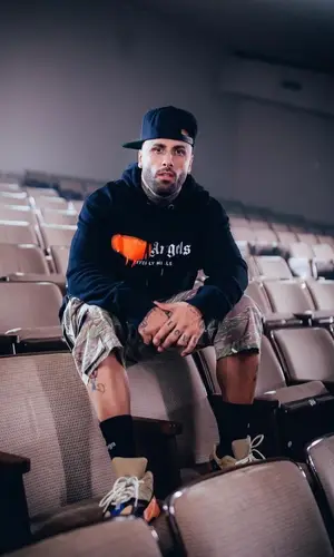 Nicky Jam wearing Palm Angels hoody