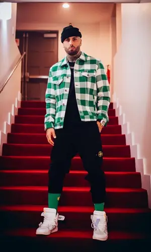 Nicky Jam wearing Palm Angels shirt