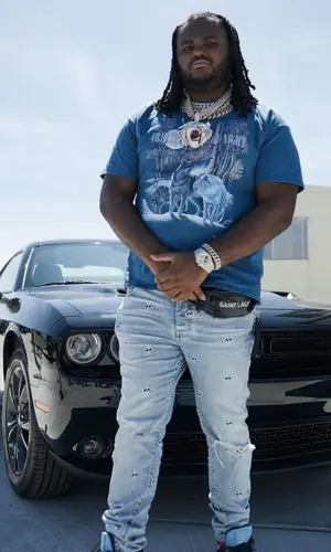 Tee Grizzley wearing Saint Laurent bag