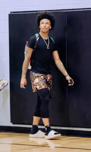 Mikey wearing Nike pants