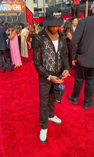 Guapdad 4000 wearing Alexander McQueen bag