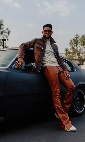 Usher wearing Berluti eyewear