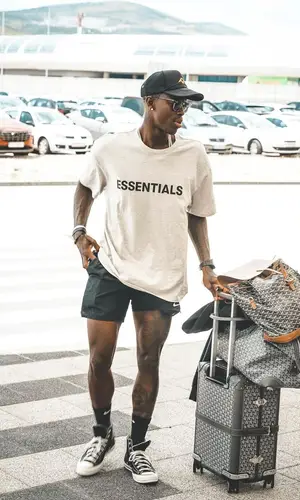 Dennis Schroder wearing Fear of God t-shirt