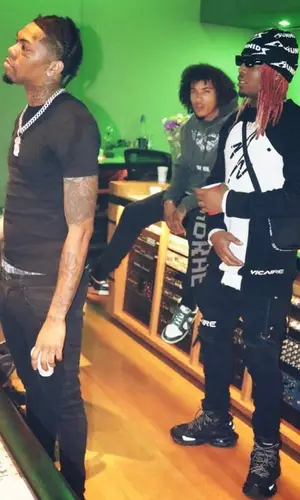 Lil Keed wearing Vicaire t-shirt