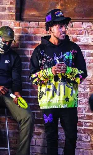 King Cid wearing Everything Rare sock