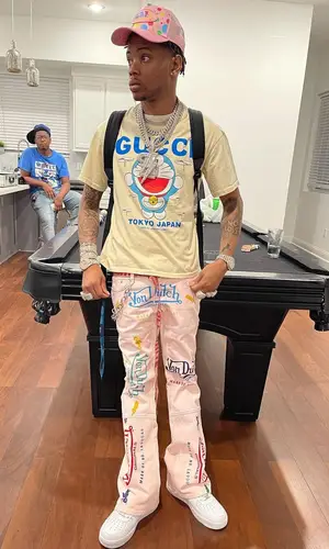 Lil Migo wearing Von Dutch cap
