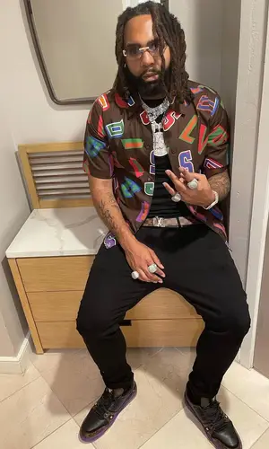 Money Man wearing Louis Vuitton shirt