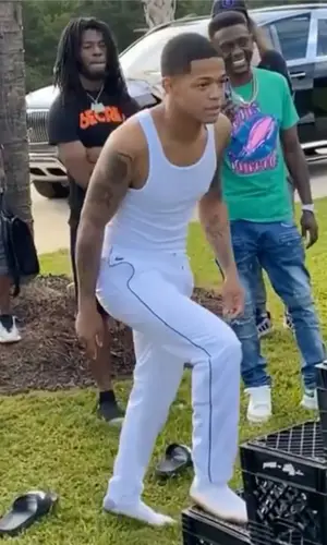 YK Osiris wearing Lacoste pants