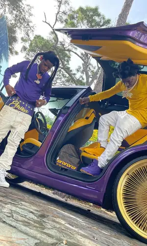 Kodak Black wearing Louis Vuitton backpack