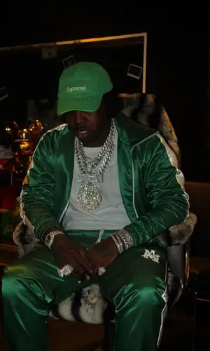 EST Gee wearing Supreme cap