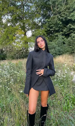 Dua Lipa wearing Jimmy Choo boots
