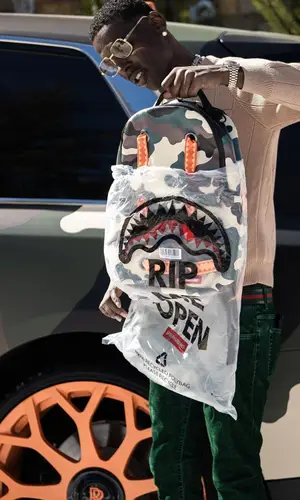 Young Dolph wearing Sprayground bag