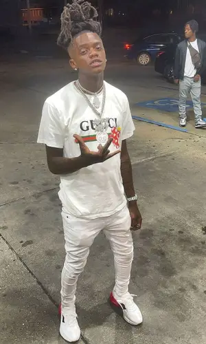 JayDaYoungan wearing Gucci sneakers