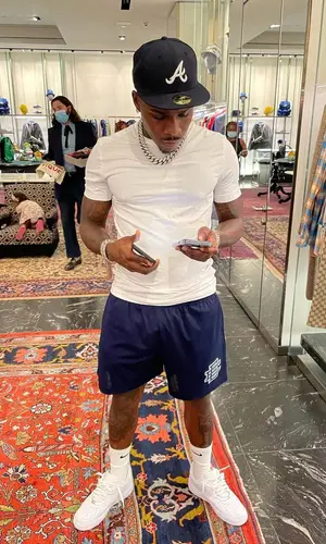 DaBaby’s Outfit in Eric Emanuel Shorts, New Era Cap & Nike Socks (2021)