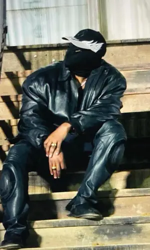 Kanye West wearing Legendary 6 cap