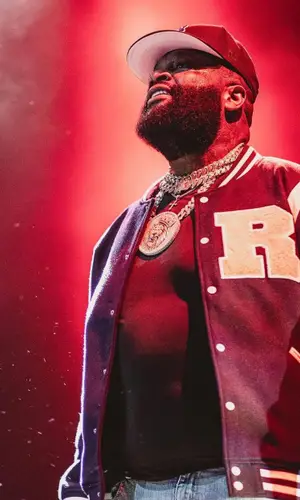 Rick Ross wearing Amiri jeans