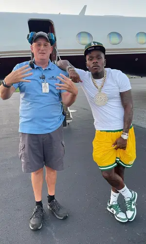 DaBaby’s Outfit in Hanes T-Shirt, Stadium Goods Shorts & New Era Cap (2021)