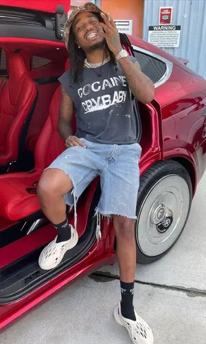 Quavo wearing Gallery Dept. sock