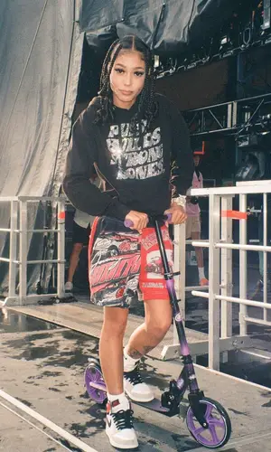 Coi Leray wearing Halo Rise Above other