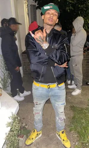 Fredo wearing Jordan sneakers