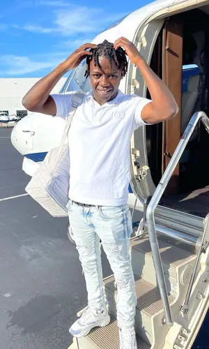 Jackboy wearing Dior backpack