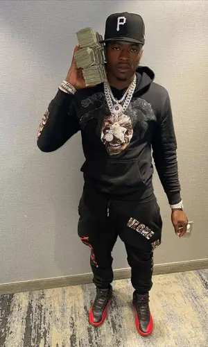 Bankroll Freddie wearing New Era cap