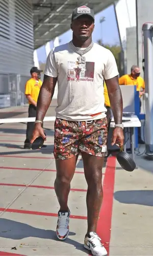 Deebo Samuel’s Outfit in Heron Preston T-Shirt, Ryoko Rain Shorts & Dsquared2 Cap (2021)