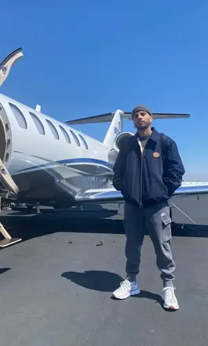 Rauw Alejandro wearing Gucci jacket