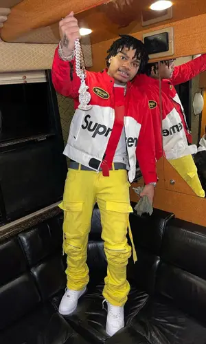 No Cap wearing Cliche Studios pants