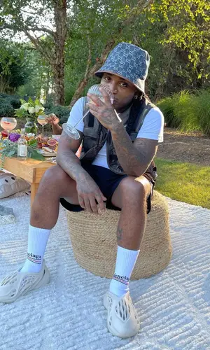 Jacquees wearing Balenciaga sock