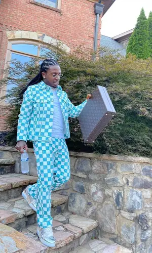 Jacquees wearing Louis Vuitton bag