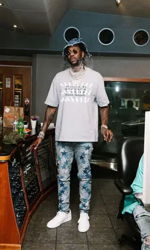 2 Chainz wearing Louis Vuitton hat