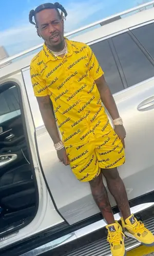 Sauce Walka wearing Sauce-A-Holic Apparel shirt