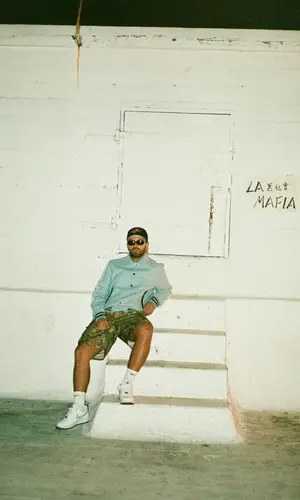 Feid wearing Amiri jacket