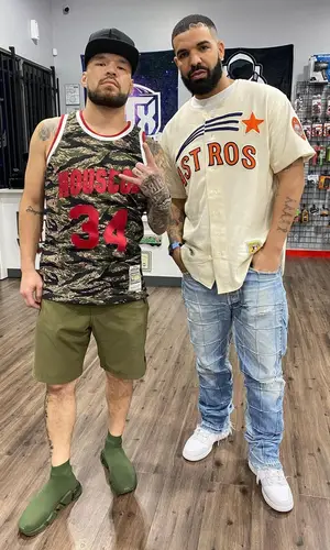Drake wearing Nike sneakers