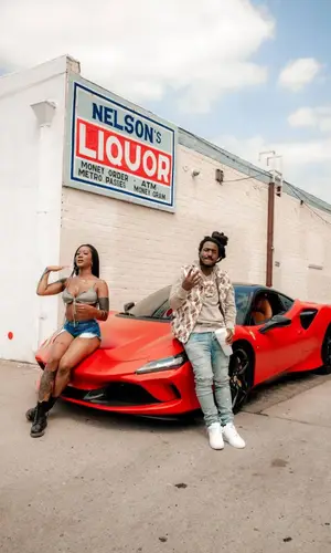 Mozzy wearing Purple Brand jeans