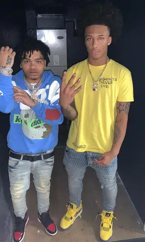 Mikey wearing Amiri jeans