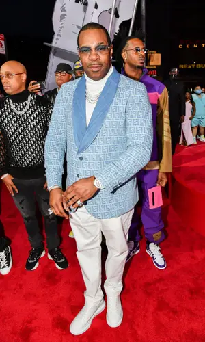 Busta Rhymes wearing Alexander McQueen sneakers
