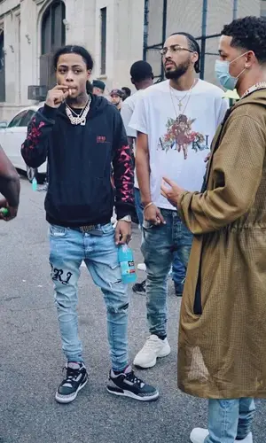 Lil Bibby’s Outfit in Amiri Jeans & Nike Sneakers (2021)