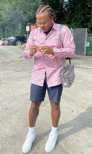 Gunna wearing Louis Vuitton bag