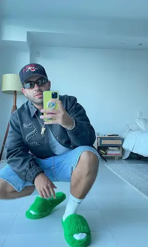 Feid wearing Supreme jacket