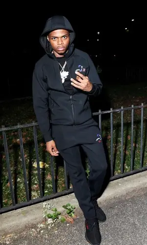 TJ Porter wearing Adidas sneakers